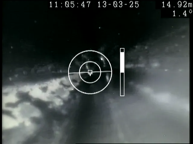 A frame from an ARPCO crawler survey at Kgotsong. The camera looks ahead along the pipe, and the recorded distance, time and pipe inclination are shown across the top of the picture.