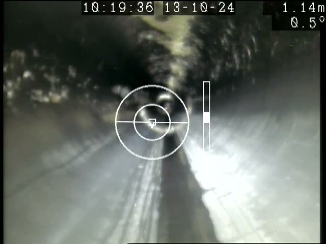 Interior of a concrete sewer near the start of an ARPCO inspection run, with the recorded distance of 1.14 metres shown across the top of the frame.