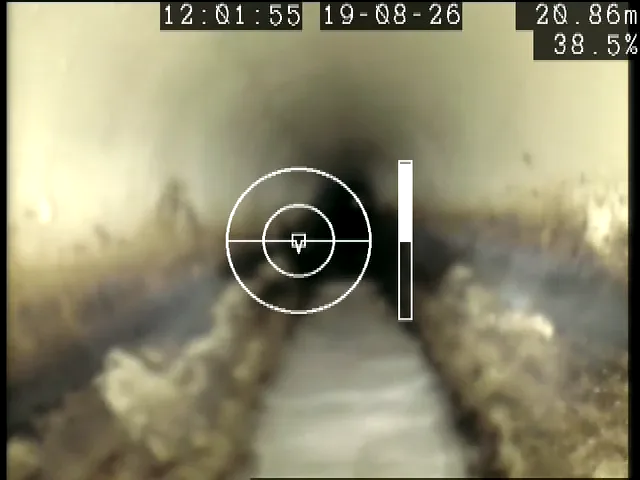 Silt and flow along the invert of a sewer, recorded at 20.86 metres into an ARPCO inspection run.