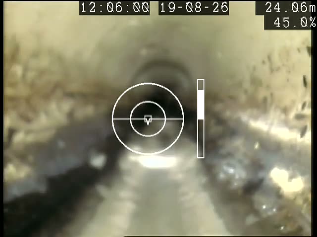 Silt and flow along the invert of a large concrete sewer, recorded on an ARPCO inspection